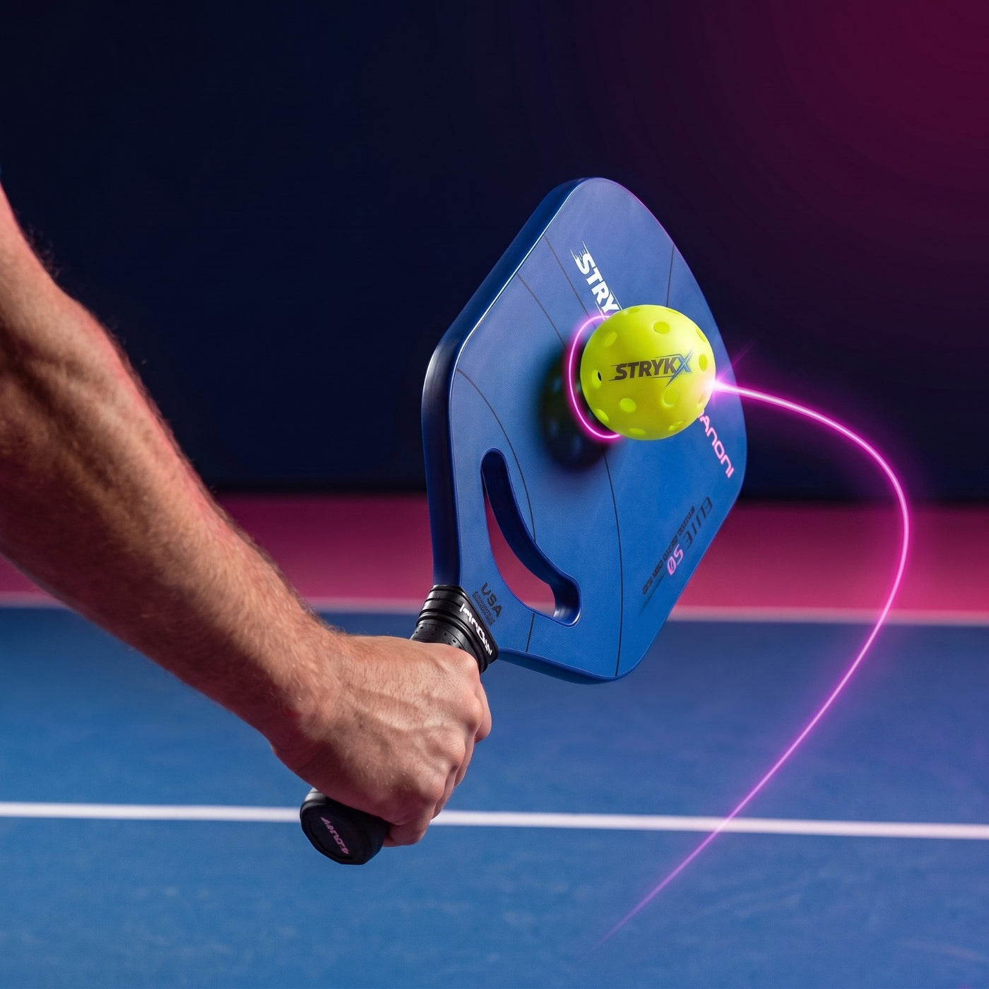 Textured raw carbon face gripping the ball