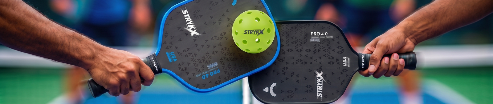 Two STRYKX paddles meeting at the net