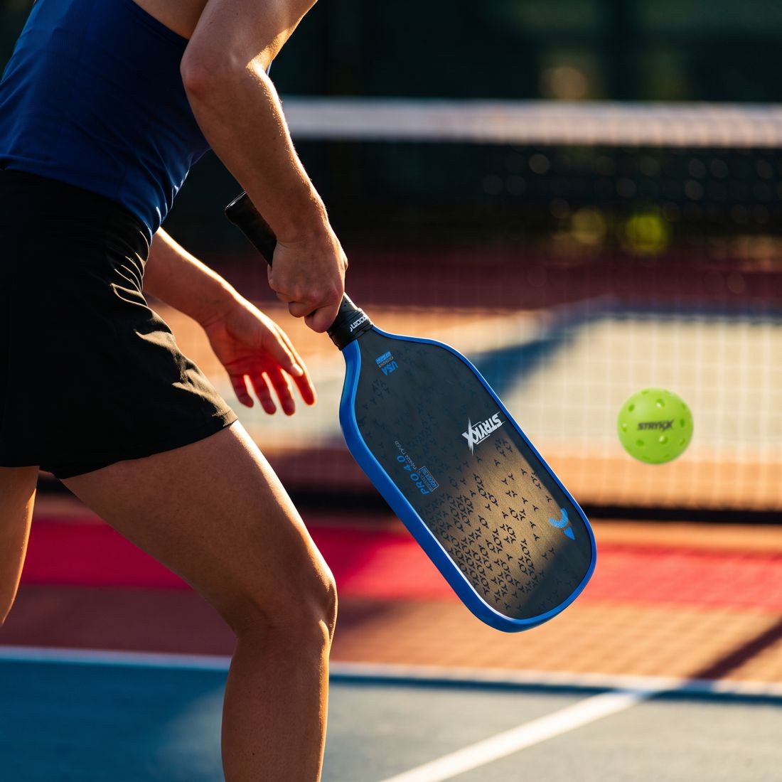 Doubles pickleball team communicating about serve order
