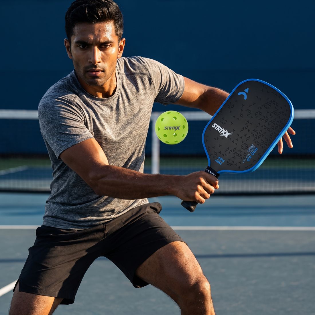 Player poaching across to intercept a shot in doubles pickleball
